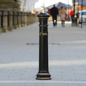 Classic design black and gold bollard on UK high street